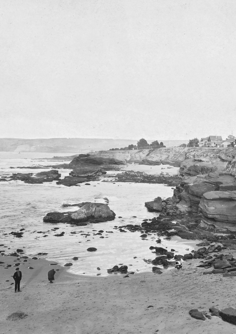 Rectangle-328 a black and white image of two people on a rocky shoreline