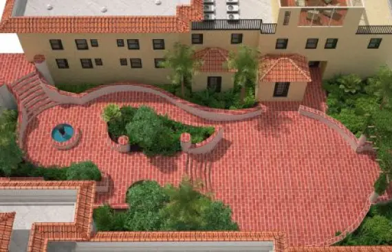 image-197 An areal view of a courtyard between two buildings. It has two gardens and a water fountain