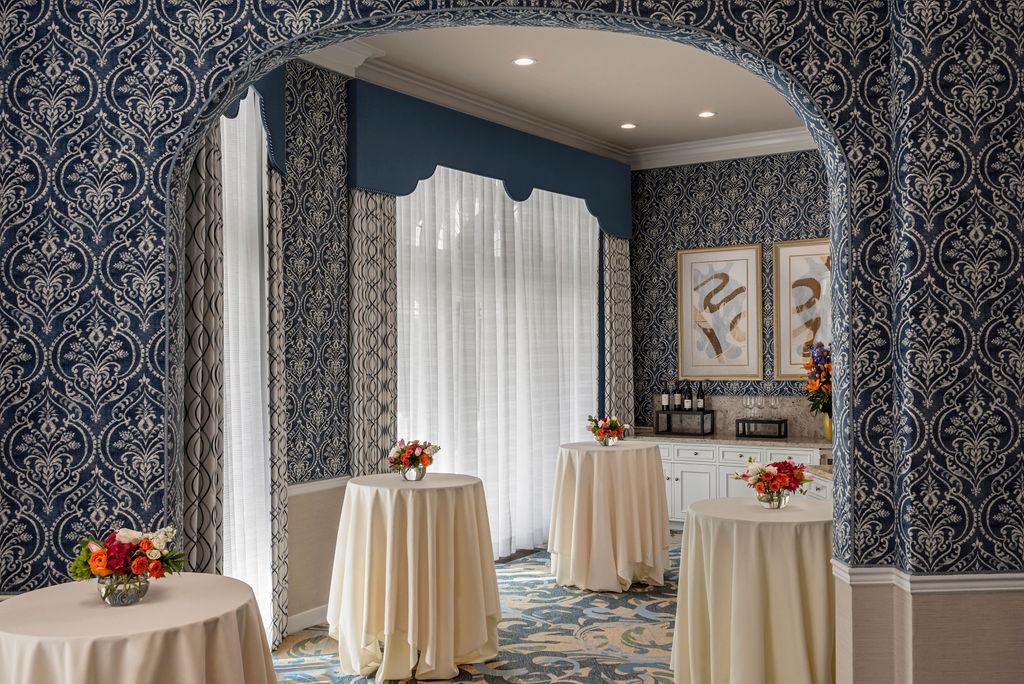 Grande-Colonial-La-Jolla-Room-Reception A reception room with four cocktail tables