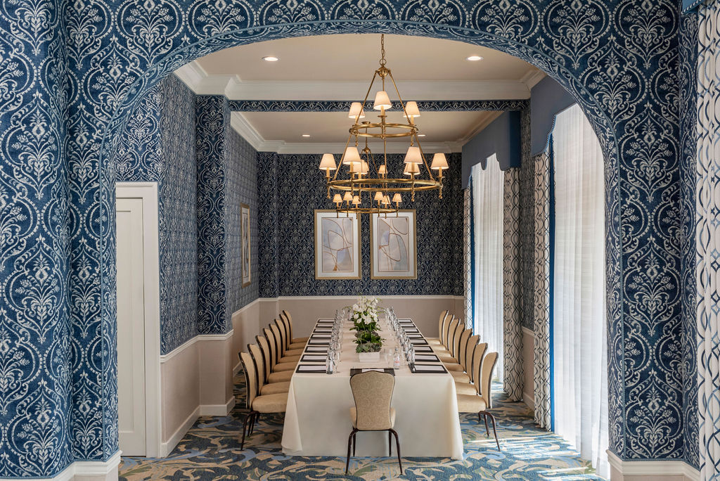 Grande-Colonial-La-Jolla-Room A meeting room with a large rectangular table with seating for ten