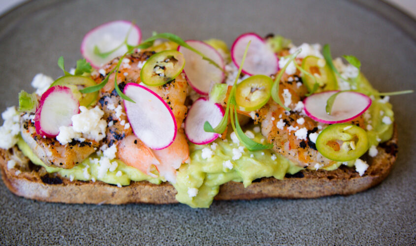 NINE-TEN Harissa Grilled Shrimp Toast with Pickled Onions & Carrots, Radish, Serrano Chili, Cilantro, Guacamole, Queso Fresco on Grilled Bread