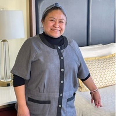 A woman standing in a hotel room