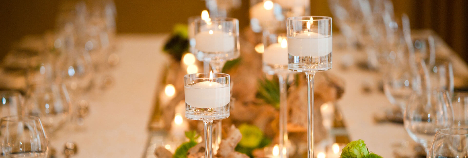 a dining table decorated with candles