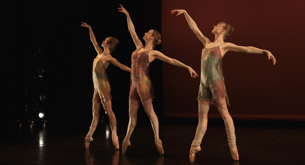 photo of three ballet dancers